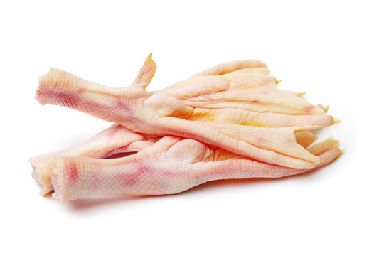 Two raw duck feet on a white background.