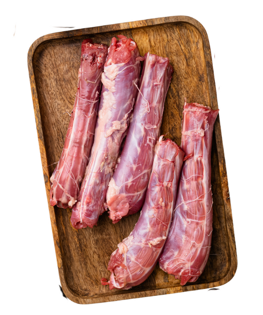 Raw meat legs on a wooden tray with a white background