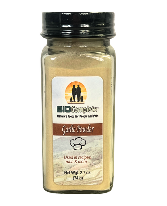 A bottle of BioComplete Garlic Powder Culinary, with a label showing the brand logo and 'Used in recipes, mad & more'.