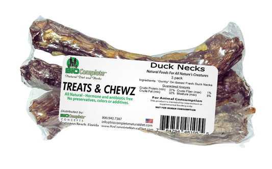 Packaged BioComplete Natural Baked Duck Necks in a clear plastic bag with branding and product information displayed.
