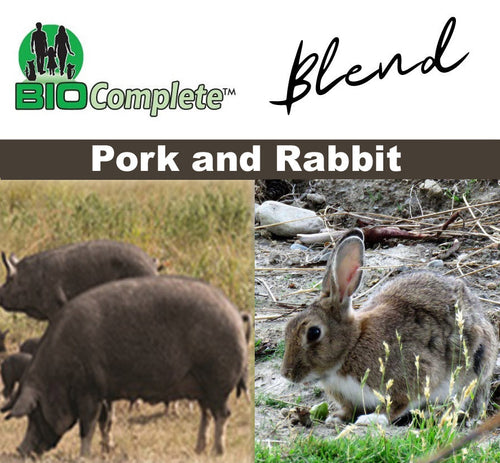 The image features a product called BioComplete Natural Raw Pork and Rabbit Blend. It shows two pictures side by side; the left side has an image of two pigs in a field, and the right side has an image of a rabbit in a natural setting.