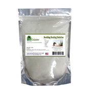 Load image into Gallery viewer, A plastic jar labeled &#39;Soothing Soaking Solution&#39; with a wooden lid on top, containing white granular substance, likely epsom salt.