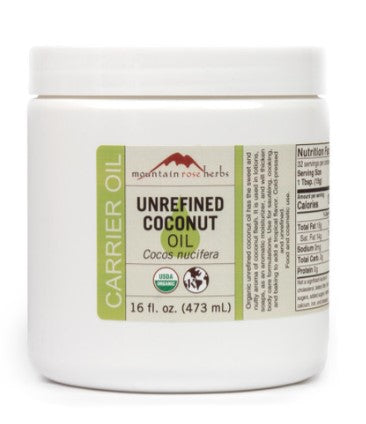 A white jar of Mountain Rose Herbs Organic Unrefined Cold-Pressed Coconut Oil with product information labels.