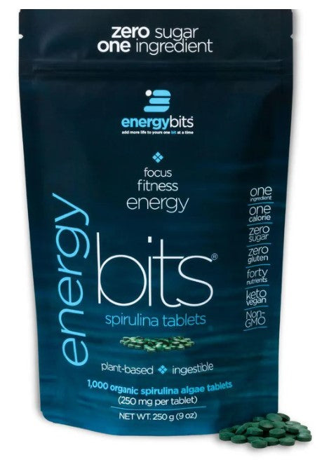 A package of ENERGYbits Spirulina tablets with the product visible in front of the package.