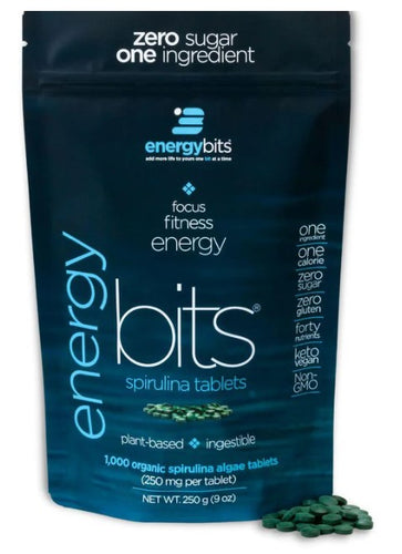 A package of ENERGYbits Spirulina tablets with the product visible in front of the package.