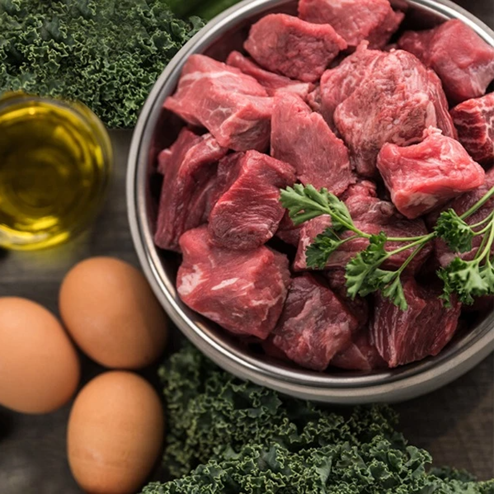 Raw meat with eggs pet food from My Paleo Pet, designed for natural pet nutrition, featuring fresh cuts of meat and whole eggs