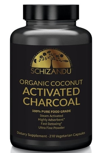 A black bottle with a gold label that reads 'Schizandu Organic Coconut Activated Charcoal', containing 210 vegetarian capsules.