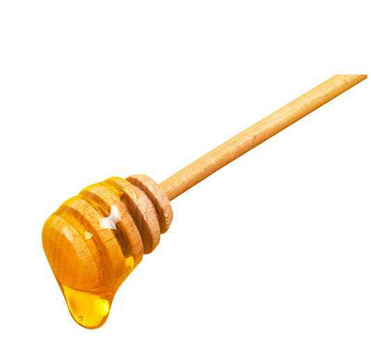 A wooden honey dipper with a drop of honey on the end, isolated on a white background.