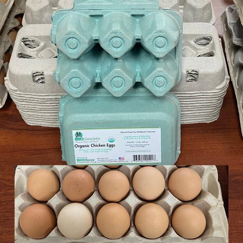 Cartons of BioComplete Florida Organic Pastured Chicken Eggs, with packaging indicating they are organic.