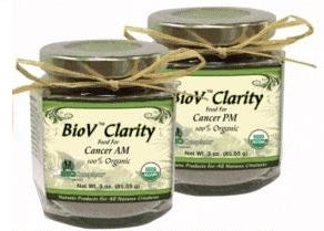 Two glass jars with green labels, titled 'BioV Clarity', containing organic herbal food packages for 'Cancer AM' and 'Cancer PM'.