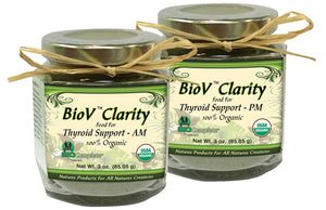Two glass jars with metal lids, one labeled for 'BioV Clarity AM for Thyroid Support' and the other for 'BioV Clarity PM for Thyroid Support'. Both are adorned with a string tie and label detailing the organic nature of the contents.